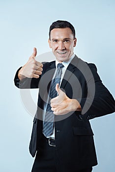 Happy optimistic man showing his optimism