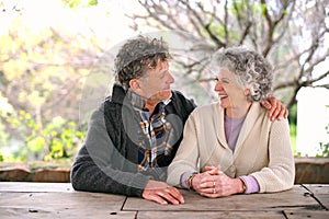 Happy, outdoor and senior couple with support and love on holiday or relax on vacation in retirement. Elderly, man and