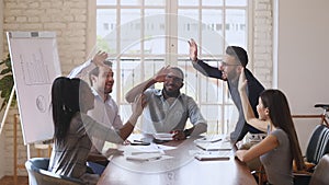 Happy overjoyed business team give high five celebrating successful contract