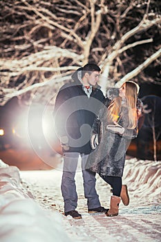Happy pair loving each other in night park filtered photo with flash flare