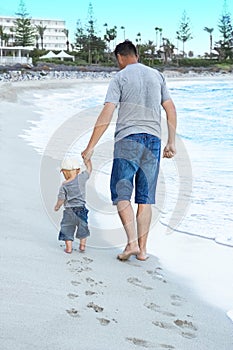 happy parent with a child by the sea in the open air