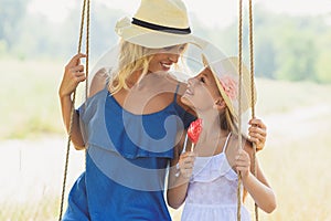 Happy parent swinging with child