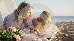 Happy parenthood concept. Preschooler kid daughter reading book having fun 4K