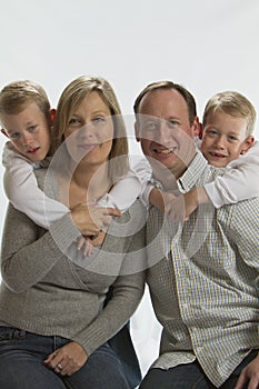 Happy parents with 6 years old identical twins