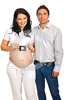 Happy parents holding sonogram