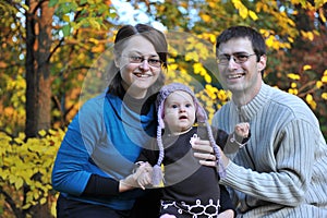 Happy parents and little girl