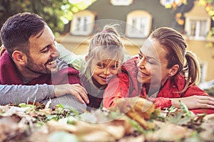 Happy parents spending time with little daughter. Close up.