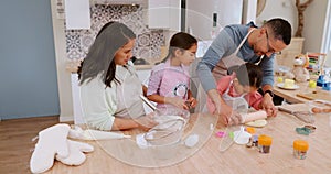 Happy parents teaching children baking as care in a home kitchen counter together to prepare dessert as a skill