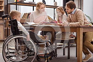 happy parents teaching children