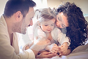 Happy parents with their little girl. Portrait.