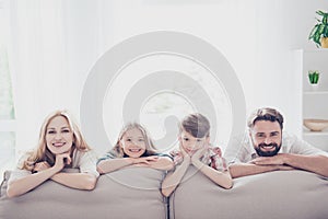 Happy parents and thier cheerful kids - blond small girl, brunet