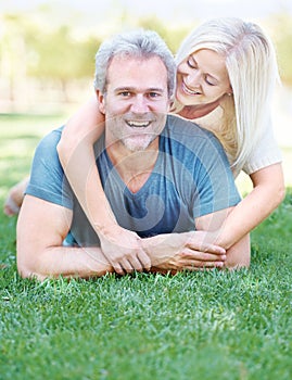 Happy, park and portrait of senior couple for bonding, relationship and commitment outdoors on grass. Love, retirement