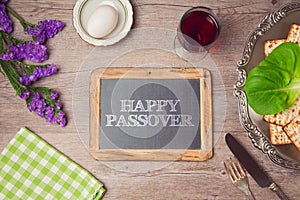 Happy Passover holiday greeting on chalkboard.