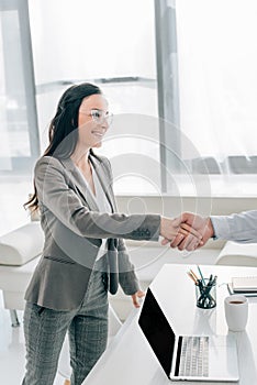 happy patient and doctor shaking hands