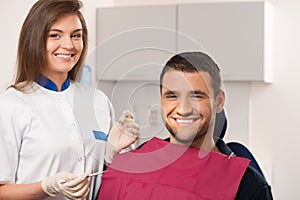 Happy patient and female dentist