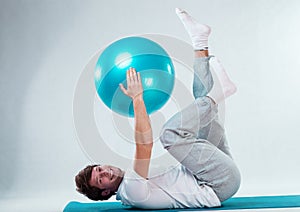 Happy patient training with fitness ball