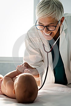Pediatric doctor exams little baby. Health care, medical examination, people concept
