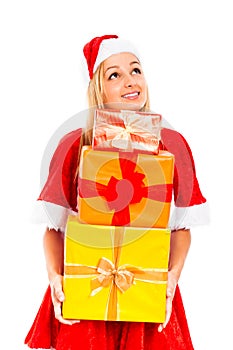 Happy pensive female Santa with Christmas gifts