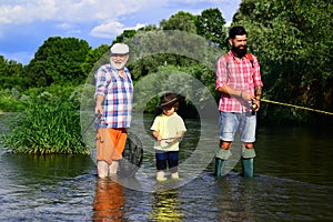 Happy people family have fishing and fun together. Fly fisherman using fly fishing rod in river. Young - adult concept