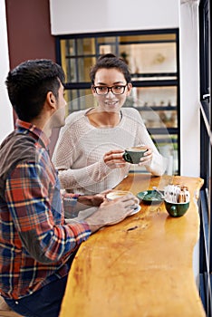 Happy people, friends and relax with coffee for morning, breakfast or chatting together at indoor restaurant. Young man