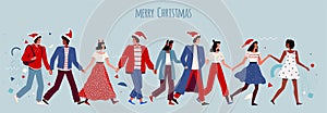 Happy people hold hands and celebrate Christmas and New Year. Joyful men and women in santa hats at a corporate party