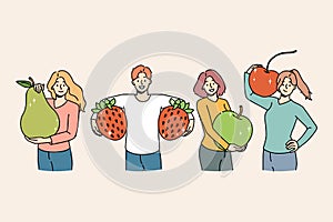 Happy people holding fruit recommend healthy diet