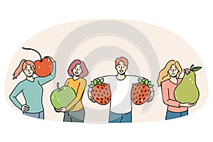 Happy people holding fruit recommend healthy diet