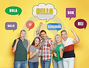 Happy people and illustration of speech bubbles with word Hello written in different languages on yellow background