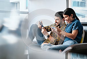 Happy People Playing Video Game With Smartphone And Laughing