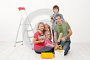 Happy people preparing to paint their home