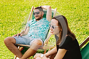 Happy People Relaxing and Communicate Outdoor on the Background Happy Young Woman Relaxing Outdoor