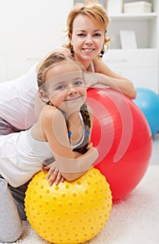 Happy people relaxing during gym exercises