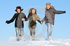 Happy people running in winter