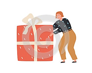 Happy person holding huge gift box. Woman carrying big enormous present wrapped in festive wrapping paper. Holiday