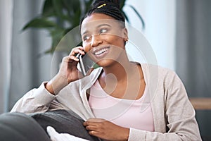 Happy, phone call and black woman on home sofa with internet connection, communication and smile. Relax, conversation