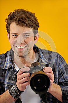 Happy photographer with SLR camera