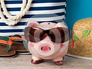 Happy piggy bank wearing sunglasses