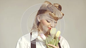 Happy pinup woman in love. Valentine`s Day, Women`s Day, Mother`s Day. Bouquet of tulips for Birthday. Beautiful girl in