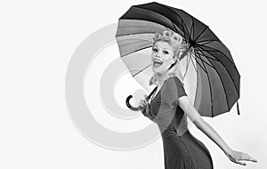 Happy pinup woman with umbrella at rainy weather. Rain rainbow autumn mood, pin up girl in red dress isolated white.