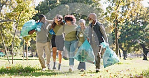 Happy, plastic bag or people in park walking for waste management or recycling in community service. Group, teamwork or