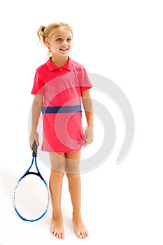 A little girl holds a tennis racket in her hands. Game, sports concept.