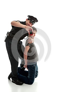 Happy policeman with apprehended teen boy