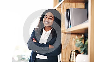 Happy, portrait or black woman with arms crossed in a law firm for consulting, legal advice and justice. Confident