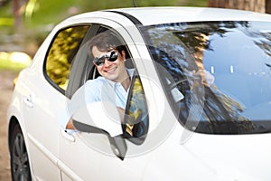 Happy, portrait and a man in a car for travel, drive or a journey on the road. Smile, morning and a person or driver in