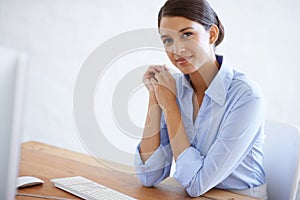 Happy, portrait and professional woman at desk in office with computer as clerk or happy secretary in administration