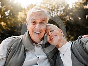 Happy, portrait and senior couple hug in a forest, love and bond in nature on a weekend trip together. Smile, face and
