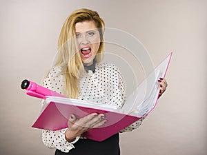 Happy positive business woman holding binder with documents