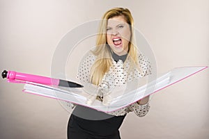 Happy positive business woman holding binder with documents