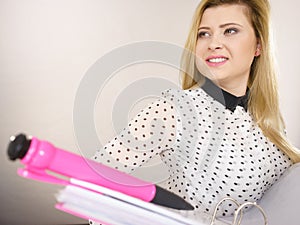 Happy positive business woman holding binder with documents