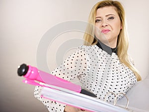 Happy positive business woman holding binder with documents